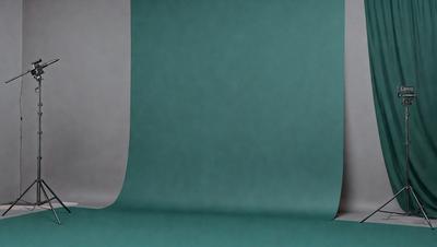 The primary subject of the image is a green cloth, which is the main object, scene, or focus of the image. The setting or background consists of a blue surface, which adds to the overall atmosphere of the image. The visual style of the image is a photo, capturing the details and colors of the green cloth. The colors and mood of the image are predominantly green and blue, creating a calm and serene atmosphere.