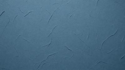 The primary subject of the image is a blue wall with a textured surface. The setting is a room with a blue background. The visual style is a close-up of the blue wall, which gives a sense of depth and texture. The dominant colors are blue and grey, creating a calm and soothing atmosphere.