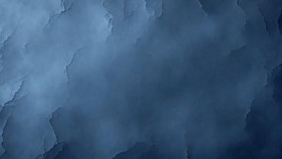 The primary subject of the image is a blue sky with a few clouds. The setting is a cloudy sky, and the visual style is a photo. The colors and mood of the image are predominantly blue, creating a calm and serene atmosphere.