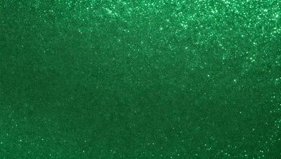 The primary subject of the image is a green background with a pattern of glittering stars. The setting is a dark room, and the visual style appears to be a digital art or illustration. The dominant colors are green and white, creating a calm and serene atmosphere.