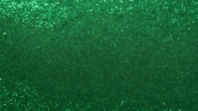 The primary subject of the image is a green background with a pattern of glittering stars. The setting is a dark room, and the visual style appears to be a digital art or illustration. The dominant colors are green and white, creating a calm and serene atmosphere.