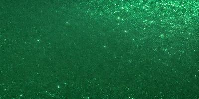 The primary subject of the image is a green background with a pattern of bright green stars. The setting appears to be a space or an artistic design, as the background is filled with these stars. The visual style of the image is a combination of a photo and digital art, creating a unique and captivating appearance. The colors and mood of the image are predominantly green, with the bright stars adding a sense of depth and vibrancy to the scene.