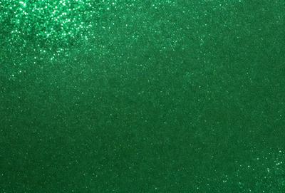 The primary subject of the image is a green background with a pattern of glittering green and white. The setting is a wall, and the visual style is a patterned background. The colors and mood of the image are predominantly green, with a hint of white, creating a lively and vibrant atmosphere.