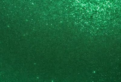 The primary subject of the image is a green background with a pattern of stars. The setting is a dark room, and the visual style appears to be a digital art or illustration. The dominant colors are green and black, creating a calm and serene atmosphere.