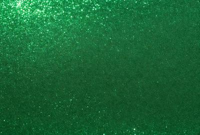 The primary subject of the image is a green background with glittery, shiny, and sparkly elements. The setting appears to be a dark room, and the visual style is a combination of a photo and digital art. The colors and mood of the image are predominantly green, with a hint of sparkle and glitter, creating a visually appealing and unique atmosphere.