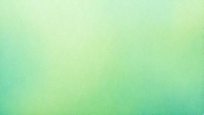 The primary subject of the image is a large, bright green wall. The setting is a room with a green background, and the visual style is a close-up of the green wall. The colors and mood of the image are predominantly green, creating a calm and serene atmosphere.