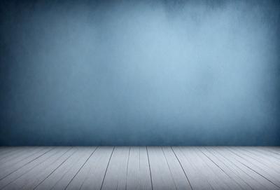 The primary subject of the image is a white wooden floor. The setting is a blue wall, which serves as the backdrop for the floor. The visual style is a photo, and the colors and mood are predominantly white and blue, creating a clean and calm atmosphere.