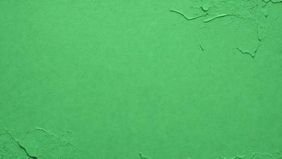 The primary subject of the image is a green wall. The setting is a room with a green wall, and the visual style is a photo. The dominant colors are green, and the overall atmosphere is calm and serene.