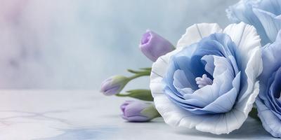 The primary subject of the image is a bouquet of purple and white flowers. The flowers are arranged in a vase, which is placed on a table. The setting is a white table, and the visual style is a photo. The dominant colors in the image are purple and white, creating a calm and serene atmosphere.