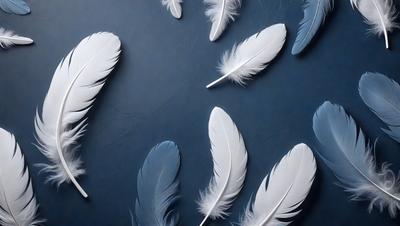 The primary subject of the image is a collection of white feathers, which are arranged in various positions on a blue surface. The setting appears to be a studio or a controlled environment, as the feathers are neatly placed and organized. The visual style of the image is a combination of photo and digital art, as the feathers are captured in a realistic manner while the blue background adds a touch of creativity. The colors and mood of the image are predominantly blue and white, creating a serene and calming atmosphere.