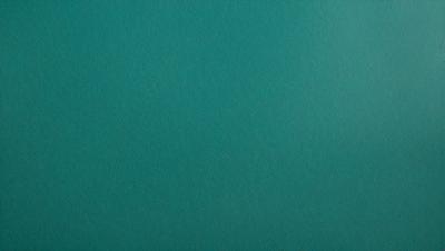 The primary subject of the image is a large, empty, and dark blue surface. The setting is a dark blue background, and the visual style is a photo. The colors and mood of the image are predominantly dark and moody, with the blue surface creating a sense of depth and mystery.
