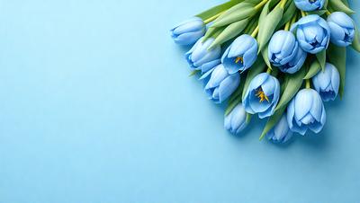 The primary subject of the image is a bouquet of blue flowers. The flowers are arranged in a vase, and they are placed on a blue surface, which could be a table or a wall. The visual style of the image is a photo, capturing the beauty of the flowers and their surroundings. The colors and mood of the image are predominantly blue, creating a calm and serene atmosphere.