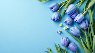 The primary subject of the image is a bouquet of blue flowers, including daffodils, arranged on a blue background. The setting is a blue wall, which serves as the backdrop for the flowers. The visual style is a close-up of the flowers, showcasing their beauty and details. The colors and mood of the image are predominantly blue, creating a calm and serene atmosphere.