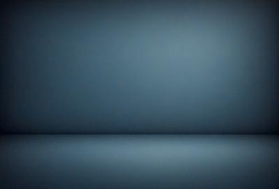 The primary subject of the image is a blue wall. The setting is a dark room with a blue background. The visual style is a photo, and the dominant colors are blue and black. The overall atmosphere is calm and serene.