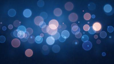 The primary subject of the image is a blue background with a pattern of bright, colorful lights. The setting appears to be a dark room, and the visual style is a combination of a photo and digital art. The colors and mood of the image are vibrant and lively, with the blue background and the bright lights creating a sense of energy and excitement.
