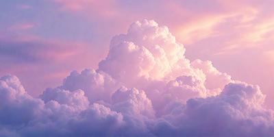 The primary subject of the image is a large, fluffy cloud in the sky. The cloud is pink and white, and it appears to be floating in a purple sky. The setting is a cloudy day, and the visual style is a natural, outdoor scene. The colors and mood of the image are serene and peaceful, with the cloudy sky and fluffy cloud creating a calming atmosphere.