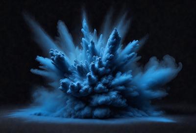 The primary subject of the image is a blue, cloud-like object that appears to be a digital art or illustration. The setting is a dark background, which contrasts with the blue object. The visual style is a combination of digital art and illustration, creating a unique and intriguing scene. The colors and mood of the image are predominantly blue, giving it a calm and serene atmosphere.