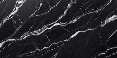 The primary subject of the image is a black and white marble pattern. The setting is a black marble wall, and the visual style is a close-up of the marble pattern. The colors and mood of the image are predominantly black and white, giving it a classic and elegant appearance.