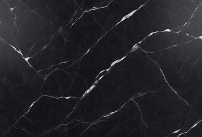 The primary subject of the image is a black marble countertop. The setting is a kitchen, with the countertop being the main focus of the scene. The visual style is a close-up of the marble countertop, showcasing its texture and pattern. The colors and mood of the image are predominantly dark, with the black marble countertop being the main source of contrast.