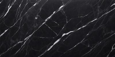 The primary subject of the image is a black marble countertop with a white pattern. The setting is a kitchen, and the visual style is a close-up of the marble countertop. The dominant colors are black and white, creating a sleek and modern atmosphere.
