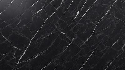 The primary subject of the image is a black marble countertop. The setting is a kitchen, with the countertop being the main focus of the scene. The visual style is a close-up of the marble countertop, showcasing its texture and pattern. The colors and mood of the image are predominantly dark, with the black marble countertop being the main source of contrast.