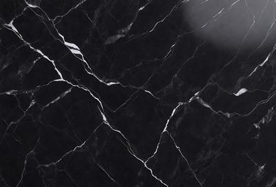 The primary subject of the image is a black marble countertop. The setting is a kitchen, with the countertop being the main focus of the scene. The visual style is a close-up of the marble countertop, showcasing its texture and details. The colors and mood of the image are predominantly dark, with the black marble countertop being the main source of contrast and visual interest.