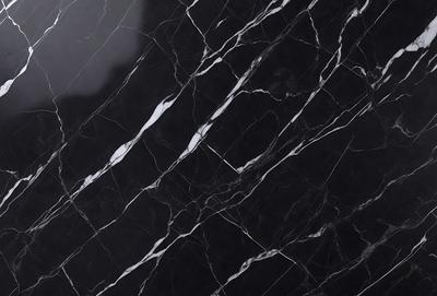 The primary subject of the image is a marble countertop with a black and white pattern. The setting is a kitchen, and the visual style is a close-up of the marble countertop. The colors and mood of the image are predominantly black and white, giving it a classic and elegant appearance.