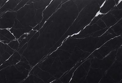 The primary subject of the image is a marble countertop with a black and white pattern. The setting is a kitchen, and the visual style is a close-up of the marble countertop. The colors and mood of the image are predominantly black and white, giving it a classic and elegant appearance.