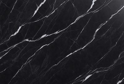 The primary subject of the image is a marble countertop with a black and white pattern. The setting is a kitchen, and the visual style is a close-up of the marble countertop. The colors and mood of the image are predominantly black and white, giving it a classic and elegant appearance.