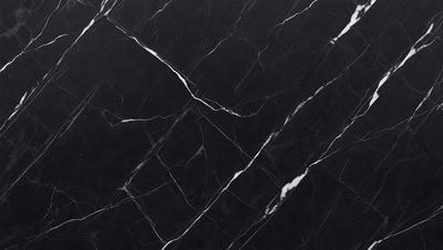 The primary subject of the image is a black marble countertop. The setting is a kitchen, with the countertop being the main focus of the scene. The visual style is a close-up of the marble countertop, showcasing its texture and pattern. The colors and mood of the image are predominantly dark, with the black marble countertop being the main source of contrast.