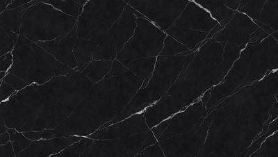 The primary subject of the image is a black marble countertop. The setting is a kitchen, with the countertop being the main focus of the scene. The visual style is a close-up of the marble countertop, showcasing its texture and details. The colors and mood of the image are predominantly black, giving it a sleek and modern appearance.