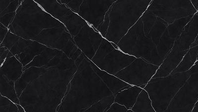 The primary subject of the image is a close-up of a marble countertop. The setting is a kitchen, with the countertop being the main focus of the scene. The visual style is a photo, capturing the intricate details of the marble surface. The colors and mood of the image are predominantly black and white, giving it a classic and elegant appearance.