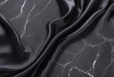 The primary subject of the image is a close-up of a black leather material, possibly a piece of clothing or a leather item. The setting is a black and white background, which adds a classic and timeless feel to the image. The visual style is a close-up, focusing on the details of the leather material. The colors and mood of the image are predominantly black and white, creating a sense of elegance and sophistication.
