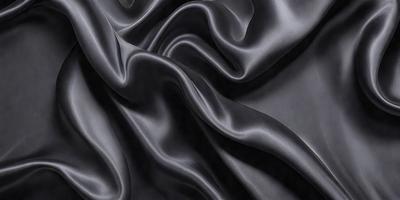 The primary subject of the image is a close-up of a black fabric, possibly a piece of silk or velvet. The setting is a dark background, which emphasizes the fabric's texture and pattern. The visual style is a detailed, up-close view of the fabric, showcasing its intricate texture and design. The colors and mood of the image are predominantly dark, with the black fabric being the main focus.