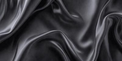 The primary subject of the image is a close-up of a piece of black fabric. The setting is a dark background, which emphasizes the fabric's texture and pattern. The visual style is a black and white photo, giving the image a classic and timeless appearance. The colors and mood are predominantly dark, with the black fabric serving as the focal point of the image.