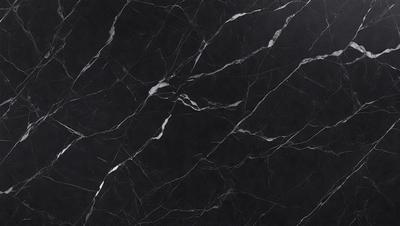 The primary subject of the image is a marble countertop with a black and white pattern. The setting is a kitchen, and the visual style is a close-up of the marble countertop. The colors and mood of the image are predominantly black and white, giving it a classic and elegant appearance.