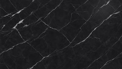 The primary subject of the image is a black marble countertop. The setting is a kitchen, with the countertop being the main focus of the scene. The visual style is a close-up of the marble countertop, showcasing its texture and pattern. The colors and mood of the image are predominantly dark, with the black marble countertop being the main source of contrast.
