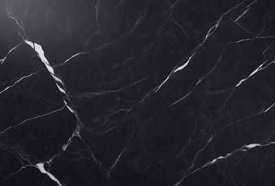 The primary subject of the image is a black marble countertop. The setting is a kitchen, with the countertop being the main focus of the scene. The visual style is a close-up of the marble countertop, showcasing its texture and pattern. The colors and mood of the image are predominantly dark, with the black marble countertop being the main source of contrast.