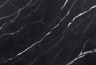 The primary subject of the image is a black marble countertop. The setting is a kitchen, with the countertop being the main focus of the scene. The visual style is a close-up of the marble countertop, showcasing its texture and pattern. The colors and mood of the image are predominantly dark, with the black marble countertop being the main source of contrast.