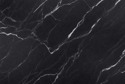The primary subject of the image is a black marble countertop. The setting is a kitchen, with the countertop being the main focus of the scene. The visual style is a close-up of the marble countertop, showcasing its texture and pattern. The colors and mood of the image are predominantly dark, with the black marble countertop being the main source of contrast.