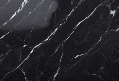 The primary subject of the image is a marble countertop with a black and white pattern. The setting is a kitchen, and the visual style is a close-up of the marble countertop. The colors and mood of the image are predominantly black and white, giving it a classic and elegant appearance.