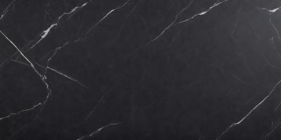 The primary subject of the image is a black marble countertop. The setting is a kitchen, with the countertop being the main focus of the scene. The visual style is a close-up of the marble countertop, showcasing its texture and appearance. The colors and mood of the image are predominantly black, giving it a sleek and modern look.