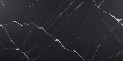 The primary subject of the image is a black marble countertop. The setting is a kitchen, with the countertop being the main focus of the scene. The visual style is a close-up of the marble countertop, showcasing its texture and details. The colors and mood of the image are predominantly dark, with the black marble countertop being the main source of contrast and visual interest.