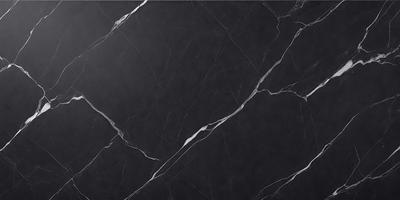 The primary subject of the image is a black marble countertop. The setting is a kitchen, with the countertop being the main focus of the scene. The visual style is a close-up of the marble countertop, showcasing its texture and details. The colors and mood of the image are predominantly dark, with the black marble countertop being the main source of contrast and visual interest.