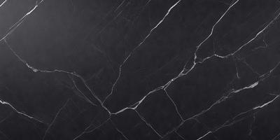The primary subject of the image is a black marble countertop. The setting is a kitchen, with the countertop being the main focus of the scene. The visual style is a close-up of the marble countertop, showcasing its texture and details. The colors and mood of the image are predominantly dark, with the black marble countertop being the main source of contrast and visual interest.