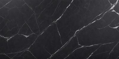 The primary subject of the image is a close-up of a marble countertop. The setting is a black background, which contrasts with the marble countertop. The visual style is a photo, showcasing the natural texture and patterns of the marble. The colors and mood of the image are predominantly black, giving it a sleek and modern appearance.