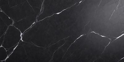 The primary subject of the image is a black marble countertop. The setting is a kitchen, with the countertop being the main focus of the scene. The visual style is a close-up of the marble countertop, showcasing its texture and details. The colors and mood of the image are predominantly dark, with the black marble countertop being the main source of contrast and visual interest.