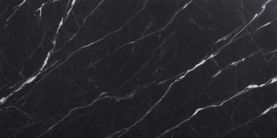 The primary subject of the image is a black marble countertop. The setting is a kitchen, with the countertop being the main focus of the scene. The visual style is a close-up of the marble countertop, showcasing its texture and pattern. The colors and mood of the image are predominantly dark, with the black marble countertop being the main source of contrast.