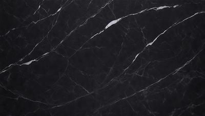 The primary subject of the image is a black marble countertop. The setting is a dark room, and the visual style is a close-up of the marble countertop. The countertop has a pattern of white veins running through it, adding a unique texture to the black surface. The overall atmosphere of the image is elegant and sophisticated.
