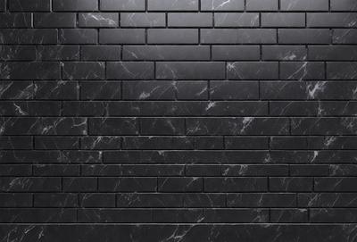 The primary subject of the image is a black brick wall. The setting is a dark room, and the visual style is a close-up of the brick wall. The colors and mood of the image are predominantly dark, with the black brick wall being the main focus.